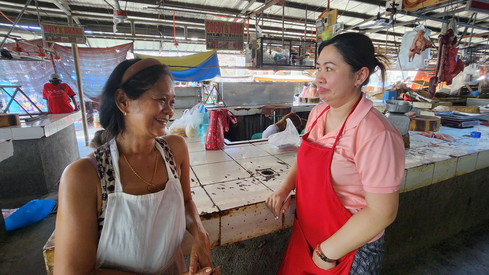 Tarlac City Meat Vendors Association vice president Tess Salvador and secretary Cristy Tañedo air their frustrations about the lack of city government assistance to the issues vendors are having at the RUA market.