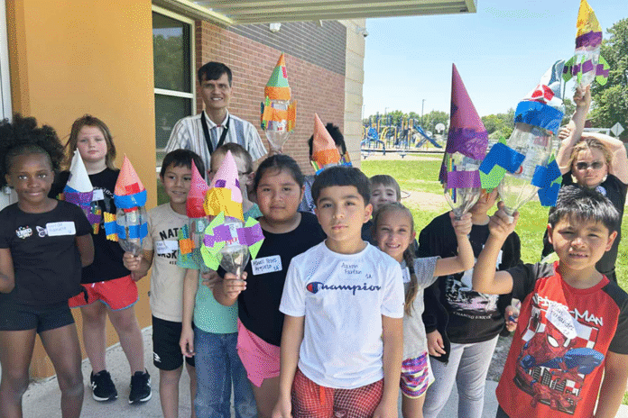 Mr. Jhony Azada with some of his students.
