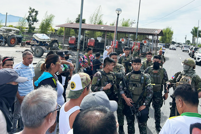SAF in tense standoff with local residents wanting to come closer to the residence of Bong Rivera.