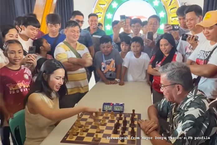 San Manuel mayor Donya Tesoro 'challenged' Asia's first chess grandmaster Eugene Torre to a friendly match.