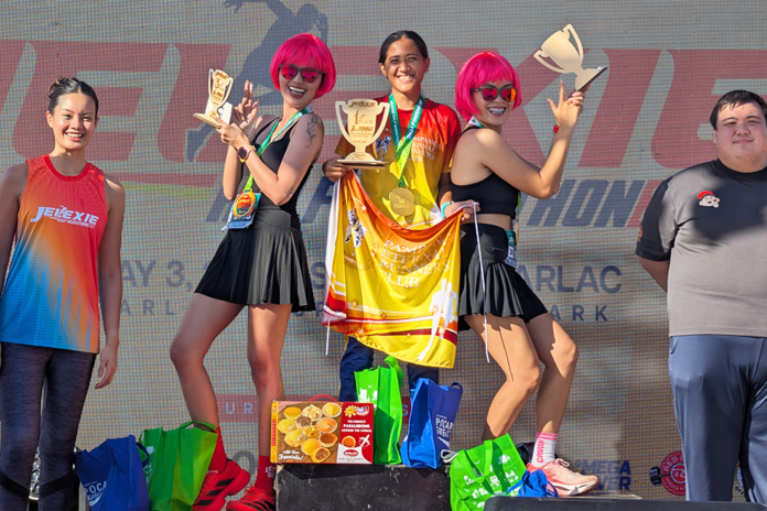 Winners creatively pose after receiving their prizes.