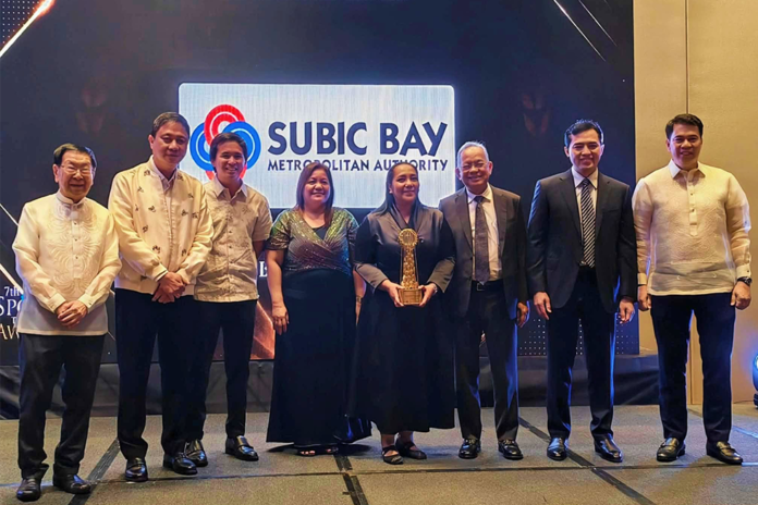 Subic Bay Metropolitan Authority (SBMA) Chairman and Administrator Eduardo Jose L. Aliño (3rd from right), Tourism Manager Mary Jamelle Camba (4th from right), with Division Chief Raquel Delos Reyes (4th from left) and the rest of the SBMA Board of Directors pose for a souvenir photo after receiving the “Destination of the Year” award for 2025 during the 7th Philippine Sports Tourism Awards held at the Manila Marriott Hotel in Metro Manila on August 24, 2026.